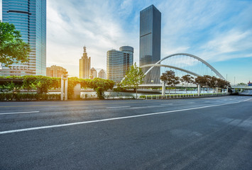 modern buildings with empty road under blue sky,tianjin china.