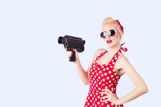 Pin up girl with vintage camera 8 mm 