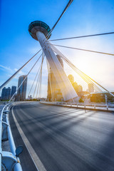 modern buildings with empty road under blue sky,tianjin china.