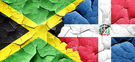 Jamaica flag with Dominican Republic flag on a grunge cracked wa