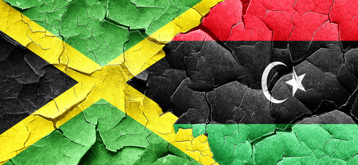 Jamaica flag with Libya flag on a grunge cracked wall
