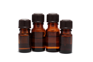 four bottles of aromatherapy oils isolated