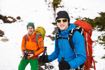 Two hikers in winter mountains