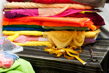 Sewing textile or cloth. Work table of a tailor.