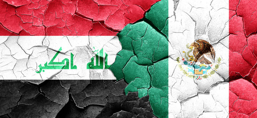 Iraq flag with Mexico flag on a grunge cracked wall