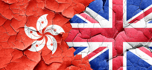 hong kong flag with Great Britain flag on a grunge cracked wall