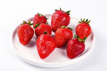 Ripe red strawberries on a white background