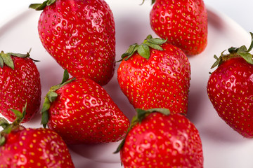 Ripe red strawberries on a white background