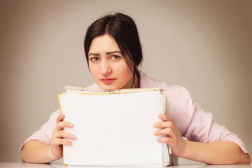 Naklejka premium tired and exhausted woman working with documents (psychologica