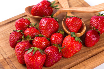 Ripe red strawberries on a white background