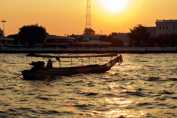 Ship / Silhouette of passenger ship floating on river at sunset.