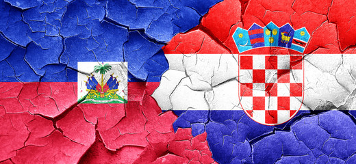 Haiti flag with Croatia flag on a grunge cracked wall