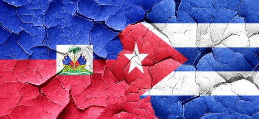 Haiti flag with cuba flag on a grunge cracked wall