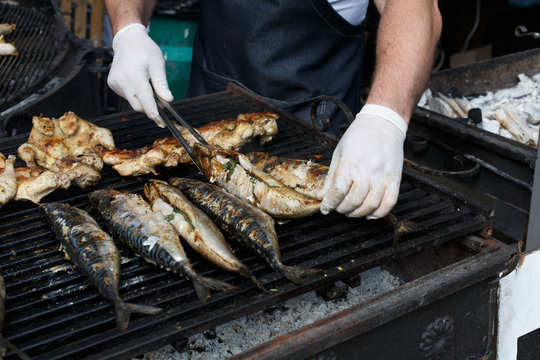 Fish mackerel and chicken tabaka grilled at bbq