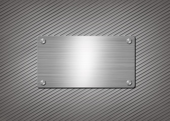 shiny metal plate on gray background