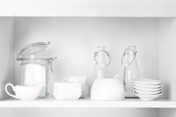 Dishes in cupboard in the kitchen