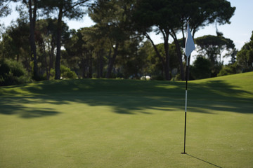 golfer hitting a sand bunker shot