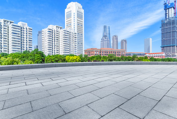 Fototapeta na wymiar empty tiled floor and urban skyline,tianjin china.