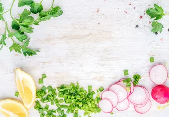 Foto op Plexiglas White wooden kitchen table background with healthy cooking ingredients and copy space. Vegetables, herbs for salad © sonyakamoz