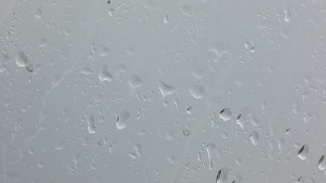 abstrac texture of the drop rain in a car glass.