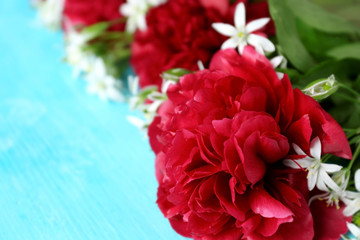 Beautiful fresh bouquet on blue background