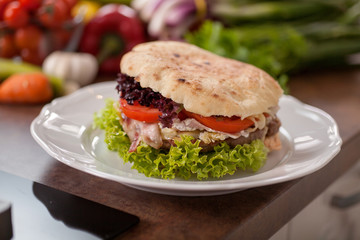 Closeup of homemade hamburger with fresh vegetables