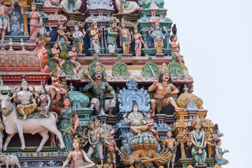 Chettinad, India - October 17, 2013:Detail of the Shiva temple gopuram at Kottaiyur shows Shiva and Parvati residing on Himalayan Kailash mountain on top of multi-headed Ravana. 