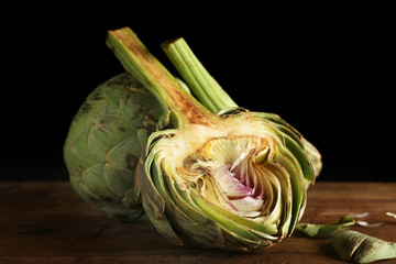 Artichokes on wooden table