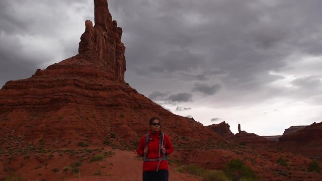 Woman Hiker Backpacker walking through the Valley of the Gods