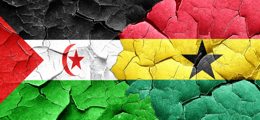 Western sahara flag with Ghana flag on a grunge cracked wall