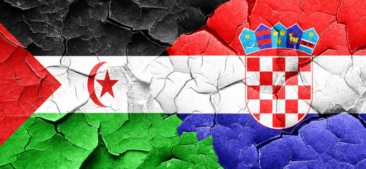 Western sahara flag with Croatia flag on a grunge cracked wall