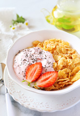 Corn flakesl, yogurt, strawberries and chia seeds