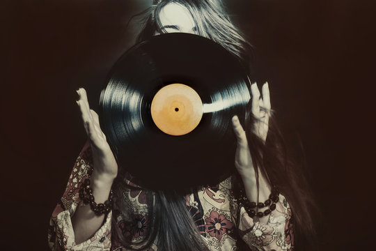 Girl holding a vinyl record