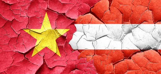 Vietnam flag with Austria flag on a grunge cracked wall