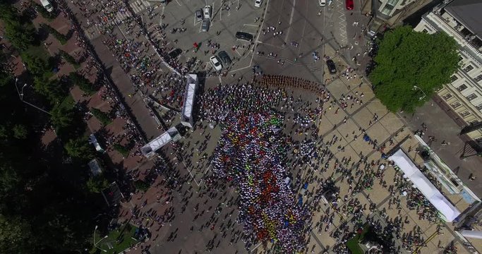 A Lot Of People Running The City Aerial View.