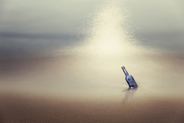 Bottle with message in sea at dusk