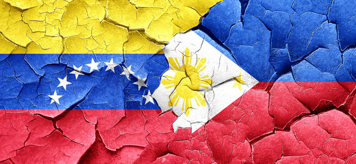 Venezuela flag with Philippines flag on a grunge cracked wall