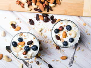 Healthy dessert with yogurt, nuts, oats and blueberries