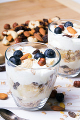 Healthy dessert with yogurt, nuts, oats and blueberries