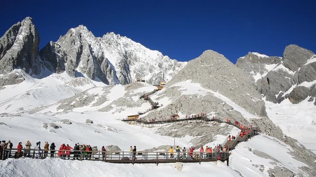 Tourists climbing up to the top of Jade Dragon Snow Mountain in Lijiang, China 