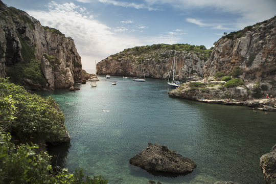 Cliffs by sea against sky