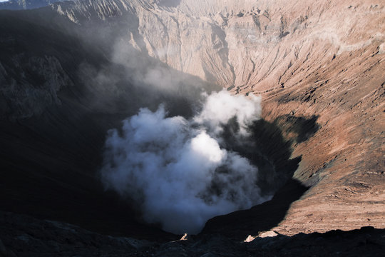 View of smoke emitting from volcano crater - Powered by Adobe