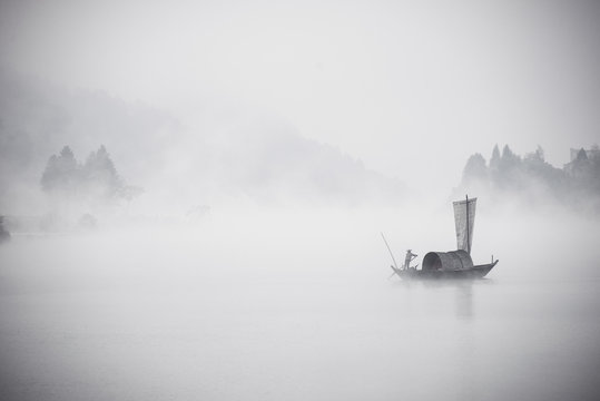 Boat moving in sea during foggy weather
