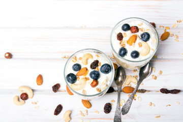 Healthy dessert with yogurt, nuts, oats and blueberries