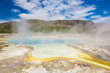Beautiful cinematic view of nature landscape in the American West under the blue cloudy sky. Geyser.