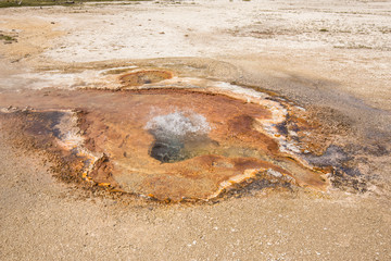 Beautiful cinematic view of nature landscape in the American West under the blue cloudy sky. Geyser.