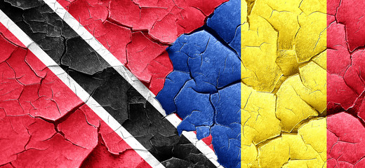 Trinidad and tobago flag with Romania flag on a grunge cracked w