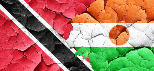 Trinidad and tobago flag with Niger flag on a grunge cracked wal