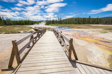 Beautiful cinematic view of nature landscape in the American West under the blue cloudy sky. Geyser.