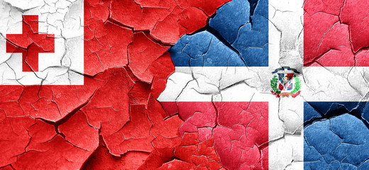 Tonga flag with Dominican Republic flag on a grunge cracked wall